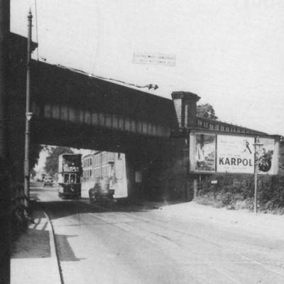 Tram Passing Under The Iron Bridge
